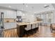 Spacious kitchen with white cabinets, granite countertops, and a large island at 3114 Woodlands Creek Dr, Monroe, NC 28110