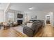 Comfortable living room features a fireplace, hardwood floors, and ample natural light at 3114 Woodlands Creek Dr, Monroe, NC 28110
