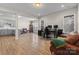 Open floor plan with living room, office, and gray kitchen featuring modern lighting at 3114 Woodlands Creek Dr, Monroe, NC 28110
