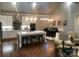 Open-concept space with kitchen island, dining area, and living room with hardwood flooring at 32 Shanklin S Ln # 32, Denver, NC 28037
