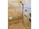 Tiled walk-in shower with granite bench and built-in niche and modern fixtures at 32 Shanklin S Ln # 32, Denver, NC 28037
