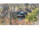 An aerial view of the home showcasing its layout and surrounding trees at 4210 Wrangler Sw Dr, Concord, NC 28027