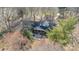 Charming home with covered front porch, mature trees, and well-maintained landscaping at 4210 Wrangler Sw Dr, Concord, NC 28027