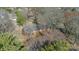 Aerial view of a single story home surrounded by mature trees at 4210 Wrangler Sw Dr, Concord, NC 28027