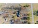 Aerial view of the house showing mature landscaping and surrounding neighborhood in winter at 4210 Wrangler Sw Dr, Concord, NC 28027