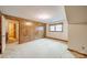 Cozy basement area with paneled walls and a window for natural light at 4210 Wrangler Sw Dr, Concord, NC 28027