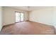 Spacious bedroom with sliding glass doors allowing for natural light at 4210 Wrangler Sw Dr, Concord, NC 28027