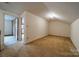 Bedroom features neutral carpet and 2 doors at 4210 Wrangler Sw Dr, Concord, NC 28027