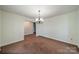 Empty dining room with light walls and ceiling fixture at 4210 Wrangler Sw Dr, Concord, NC 28027