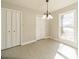 Neutral dining room featuring a large window, light wood floors and two closets at 4210 Wrangler Sw Dr, Concord, NC 28027