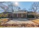 Brick ranch-style home with large front porch at 4210 Wrangler Sw Dr, Concord, NC 28027