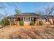 Charming brick home with inviting front porch and well-manicured landscaping at 4210 Wrangler Sw Dr, Concord, NC 28027