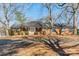 Charming brick home featuring a well-manicured front yard and a paved driveway at 4210 Wrangler Sw Dr, Concord, NC 28027