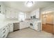 Bright kitchen with stainless steel appliances and ample white cabinetry at 4210 Wrangler Sw Dr, Concord, NC 28027