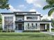 Stunning modern home boasts a clean design, sleek lines, large windows, and a well-manicured lawn at 434 Lansdowne Rd, Charlotte, NC 28270