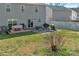 Spacious backyard with a mix of grass and a concrete patio area at 4716 Meadowfield Rd, Charlotte, NC 28215