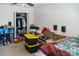 Cluttered bedroom with a large window and closet at 4716 Meadowfield Rd, Charlotte, NC 28215