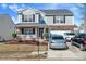 Charming two-story home with brick and siding, a welcoming front porch, and a well-maintained yard and driveway at 4716 Meadowfield Rd, Charlotte, NC 28215