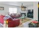 Bright living room with a fireplace and a cozy seating area, enhanced by natural light and neutral tones at 4716 Meadowfield Rd, Charlotte, NC 28215