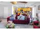 Open-concept living room with a sofa and natural lighting. The kitchen is in the background at 4716 Meadowfield Rd, Charlotte, NC 28215
