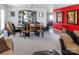 Open-concept living room with a dining area, showcasing a display cabinet and comfortable seating at 4716 Meadowfield Rd, Charlotte, NC 28215