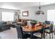 Cozy living room and dining area with ample seating, complemented by a decorative chandelier at 4716 Meadowfield Rd, Charlotte, NC 28215