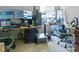 Office features dual monitors, a keyboard, desktop and office chairs at 4716 Meadowfield Rd, Charlotte, NC 28215