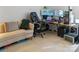 Office features a couch, desk, monitor, and rolling chair at 4716 Meadowfield Rd, Charlotte, NC 28215