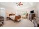 Bright main bedroom with a tray ceiling, a bay window, and a plush king-size bed at 4724 1St Ne St, Hickory, NC 28601