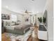 Bright bedroom featuring hardwood floors, a ceiling fan, and neutral décor at 590 Main Sw St, Concord, NC 28027