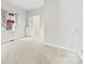 Another view of the neutral bedroom with carpet flooring and bright window at 590 Main Sw St, Concord, NC 28027