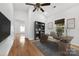 Home office features a modern desk, bookcase, and natural lighting at 590 Main Sw St, Concord, NC 28027