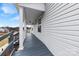 Side porch of home featuring painted wood flooring and white vinyl siding at 590 Main Sw St, Concord, NC 28027