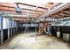 Spacious basement featuring exposed ductwork, stairs and a concrete foundation at 7047 Cheyenne Dr, Charlotte, NC 28262