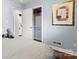 Bedroom featuring closet and a view into the laundry room at 7047 Cheyenne Dr, Charlotte, NC 28262