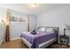 Bedroom featuring a queen bed, large window, side tables and lamps at 7047 Cheyenne Dr, Charlotte, NC 28262