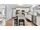 Updated kitchen with an island featuring seating at 7047 Cheyenne Dr, Charlotte, NC 28262