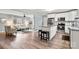 Bright kitchen with a center island, stainless steel appliances, and a view to the living area at 7047 Cheyenne Dr, Charlotte, NC 28262