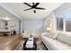 Cozy living room with hardwood floors, a large window, and dining area at 7047 Cheyenne Dr, Charlotte, NC 28262