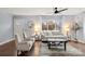 Bright living room features a large window, hardwood floors and neutral decor at 7047 Cheyenne Dr, Charlotte, NC 28262