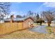 Brick home with a fenced yard at 7047 Cheyenne Dr, Charlotte, NC 28262