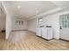 Large, bright basement with a washer and dryer, new floors, and a back door at 7407 Forney Hill Rd, Denver, NC 28037