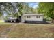 Charming two-story home featuring a white exterior with black brick accents and a well-maintained front yard at 7407 Forney Hill Rd, Denver, NC 28037