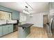 Bright kitchen with granite countertops, island, stainless steel appliances, and lots of natural light at 7407 Forney Hill Rd, Denver, NC 28037