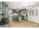 Bright kitchen with granite countertops, island, stainless steel appliances, and lots of natural light at 7407 Forney Hill Rd, Denver, NC 28037