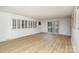 An expansive living room featuring vinyl floors, plantation shutters, and modern minimalist design at 7407 Forney Hill Rd, Denver, NC 28037