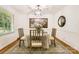 Inviting dining room with a round table, elegant decor, and natural light at 7613 Whistlestop Rd, Charlotte, NC 28210