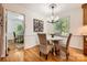 Cozy breakfast nook with a round table, wicker chairs, and ample natural light at 7613 Whistlestop Rd, Charlotte, NC 28210