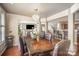 Open dining room with a large table and chandelier at 803 Coach House Ct, Rock Hill, SC 29730
