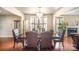 Bright dining room with hardwood floors, chandelier, and large windows at 803 Coach House Ct, Rock Hill, SC 29730